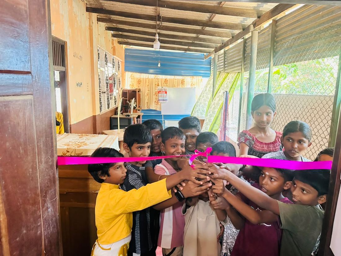Children opening the IT training room together at the Future in Their Hands launch